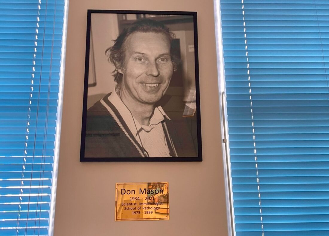 Black and White photograph of Prof Son Mason on the wall on the flow cytometry facility