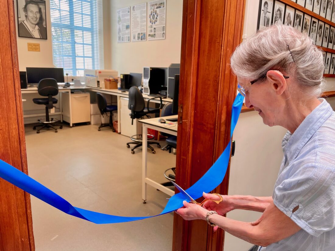 The window of Don Mason cuts a blue ribbon at the door of the inaugurated facility