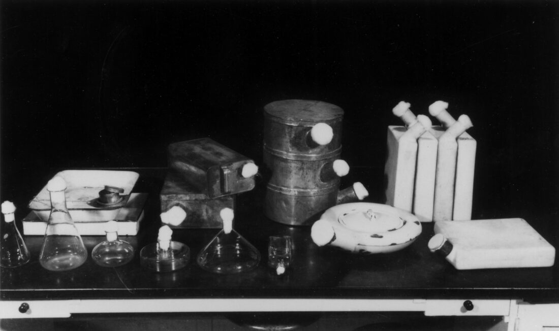 variety of items used to produce penicillin in the 1940s, including biscuit tins and old bed pans